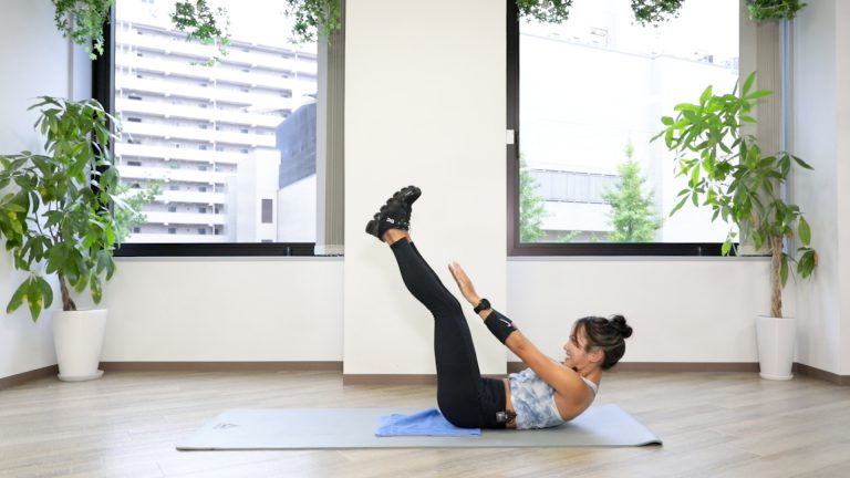 A dedicated athlete performing an intense core training exercise, representing the athletic excellence featured on the ACC Network